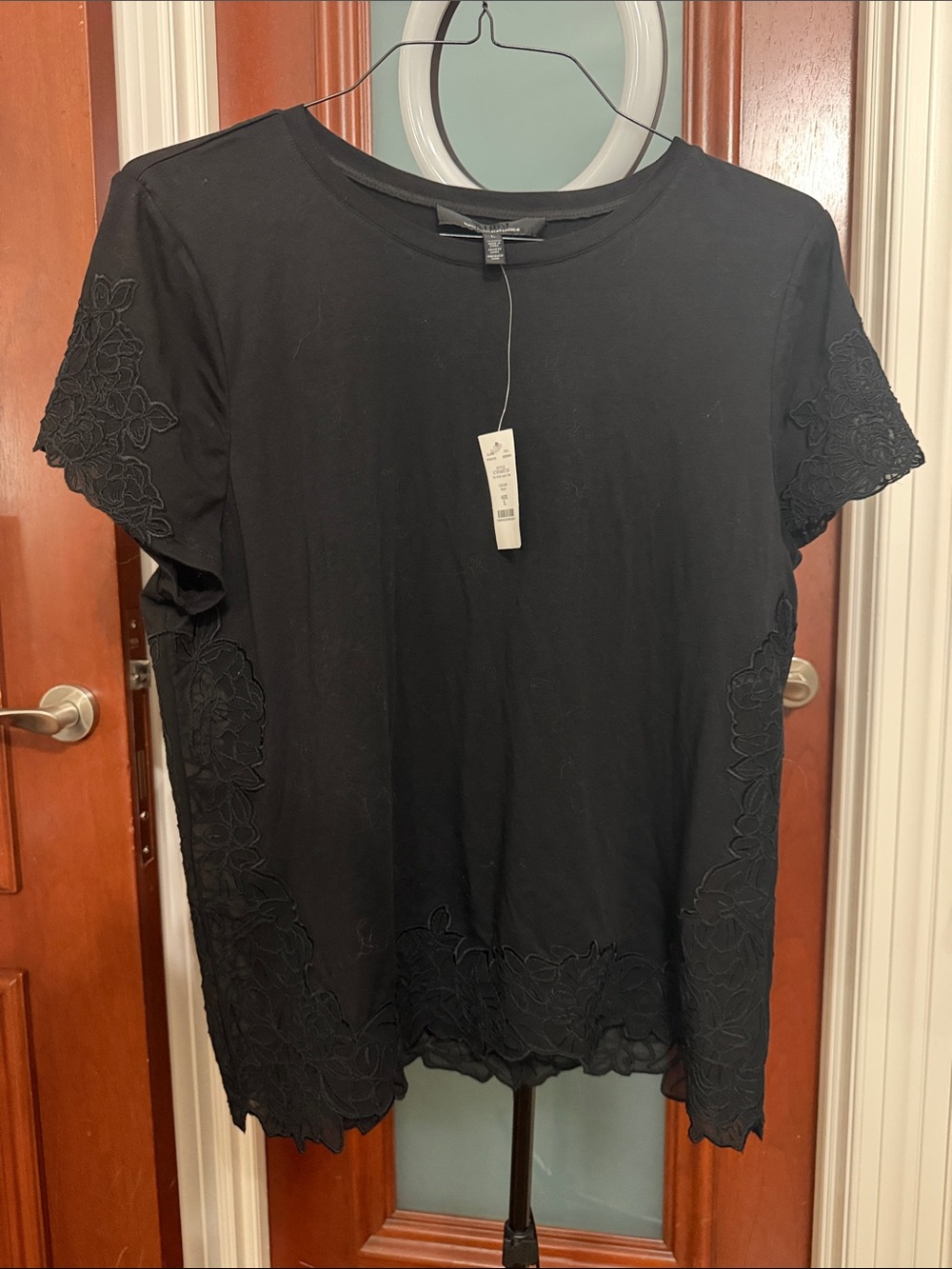 Black shirt with sheer floral detailing, NWT from WHBM